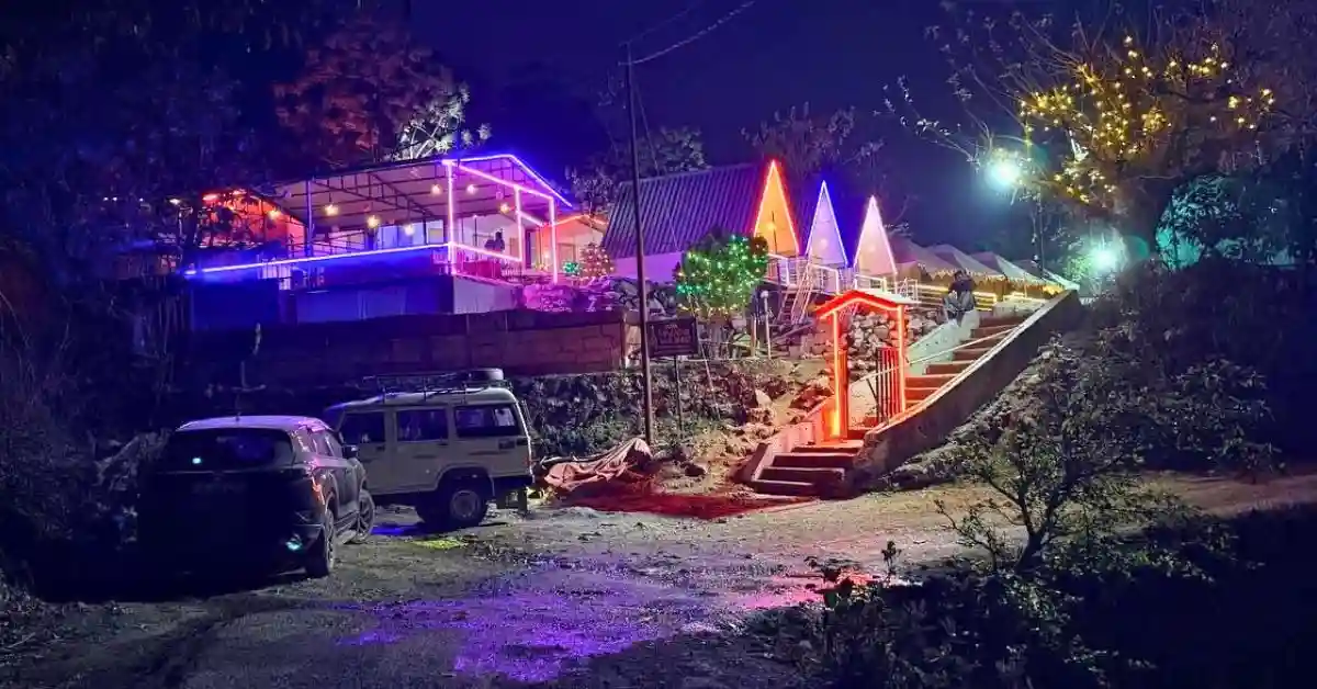Valencia River Resort exterior view with colorful neon lights at night